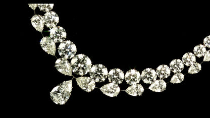 PEAR AND ROUND BRILLIANT CUT DIAMOND NECKLACE, 18K GOLD AND PLATINUM